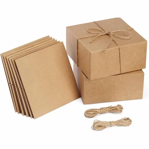 Kraft cardboard gift boxes in different sizes with natural paper string